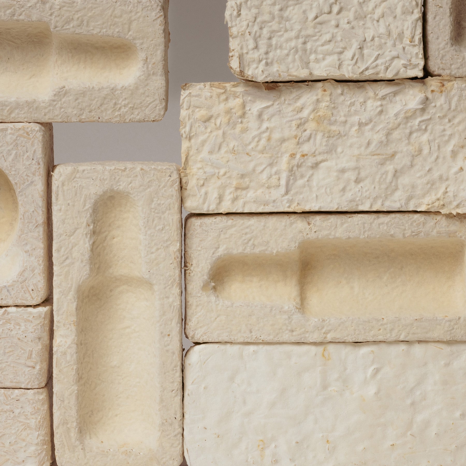 Close-up of Medshrum eco-friendly mycelium packaging, featuring textured, natural-looking materials that resemble mushrooms, highlighting innovative and sustainable design for environmentally conscious products.