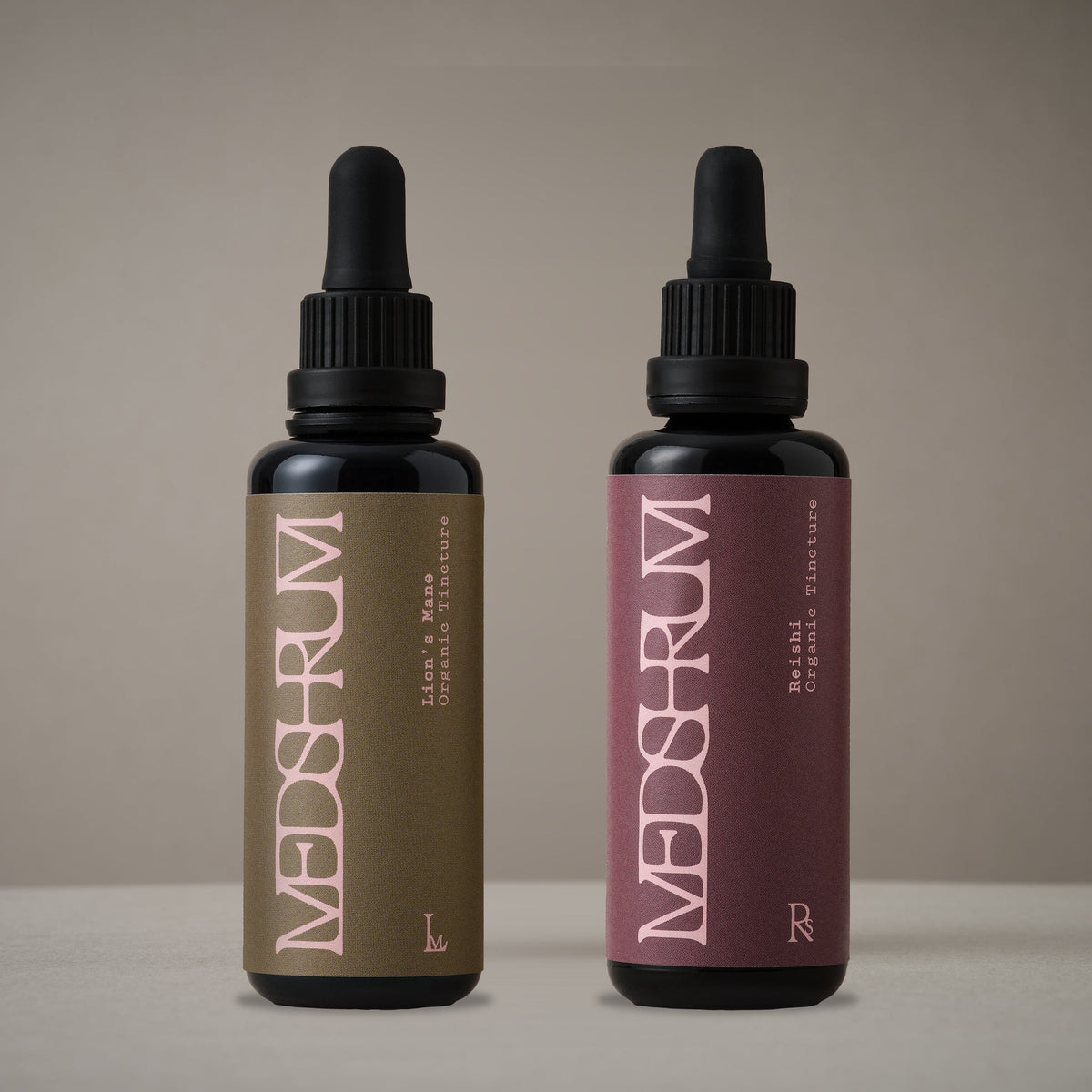 The AM/PM Edit with Medshrum Organic Lion's Mane and Reishi tinctures photographed on the Medshrum neutral tabletop background