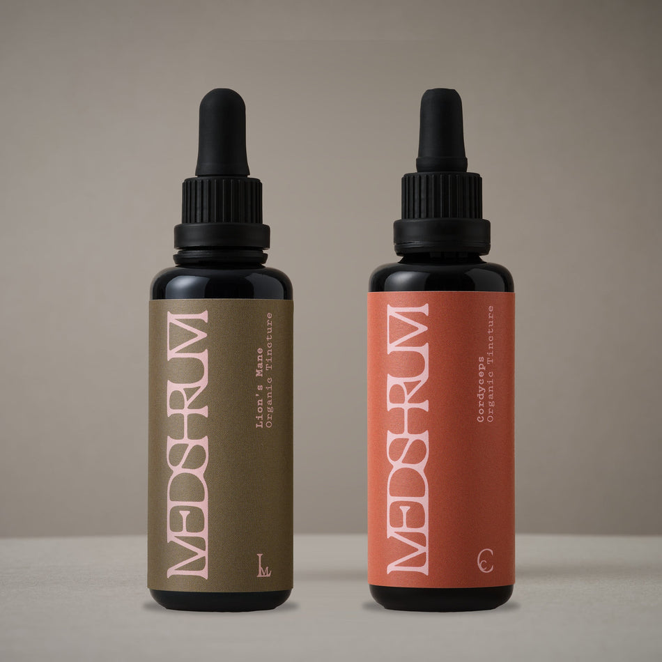 The Day Edit with Medshrum Organic Lion's Mane and Cordyceps tinctures photographed on the Medshrum neutral tabletop background