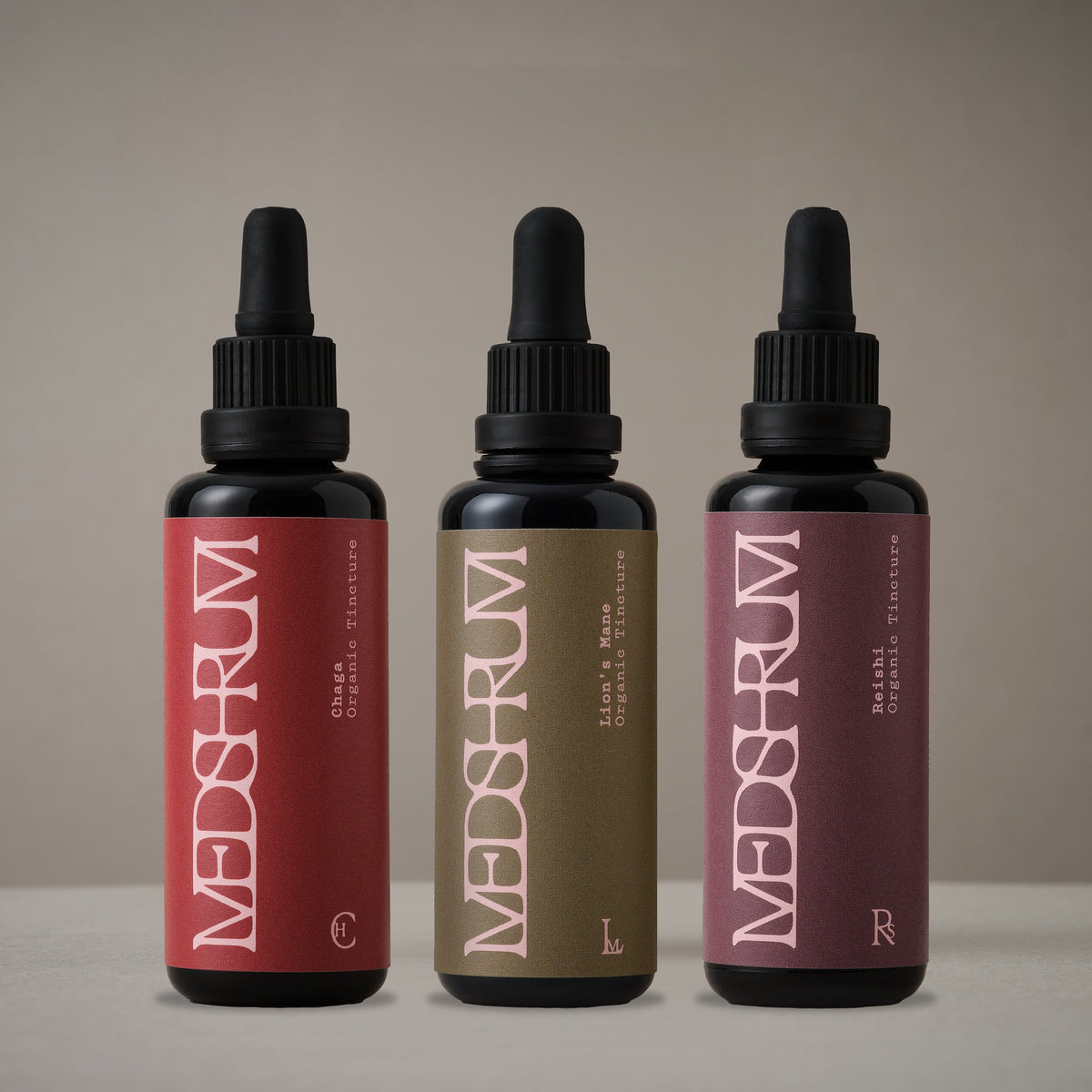 The Long Horizon Series with Medshrum Organic Chaga, Lion's Mane and Reishi tinctures photographed on the Medshrum neutral tabletop background