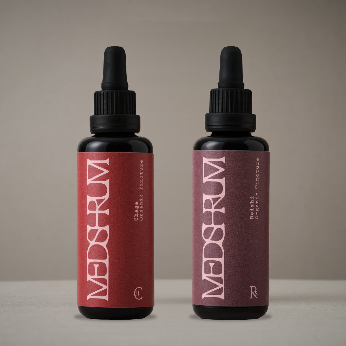 The Night Edit with Medshrum Organic Chaga and Reishi tinctures photographed on the Medshrum neutral tabletop background