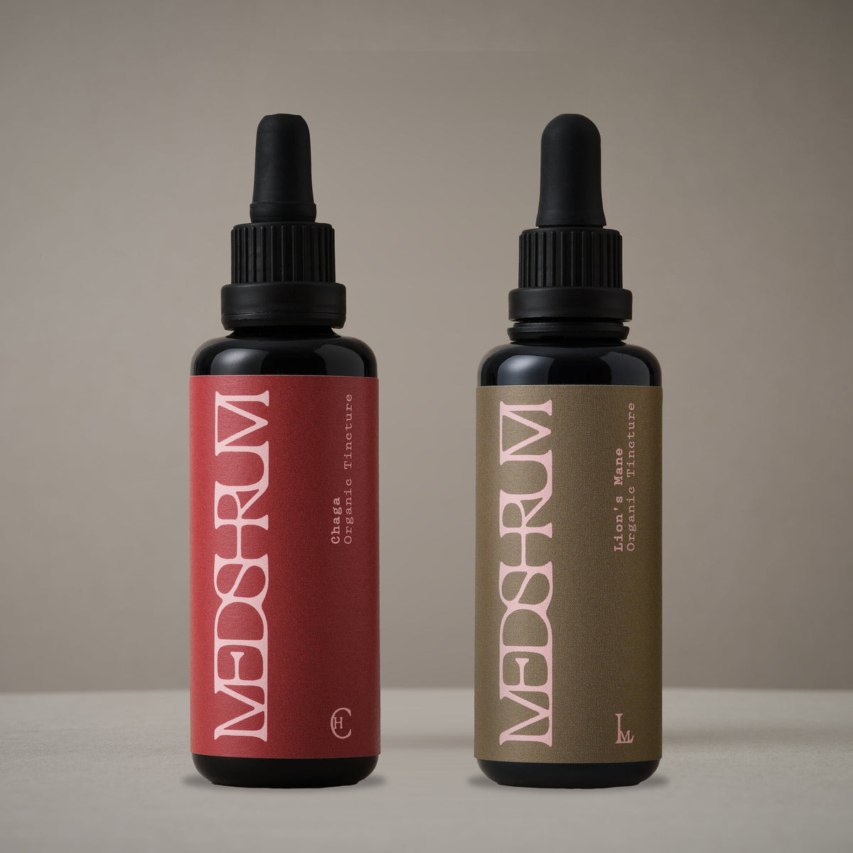 The Inner Radiance Edit with Medshrum Organic Chaga and Lion's Mane tinctures photographed on the Medshrum neutral tabletop background